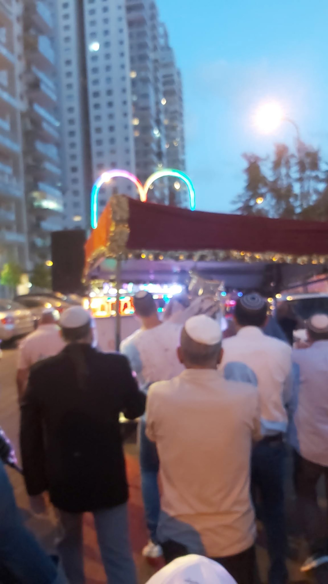 Participants walking together in an evening community procession